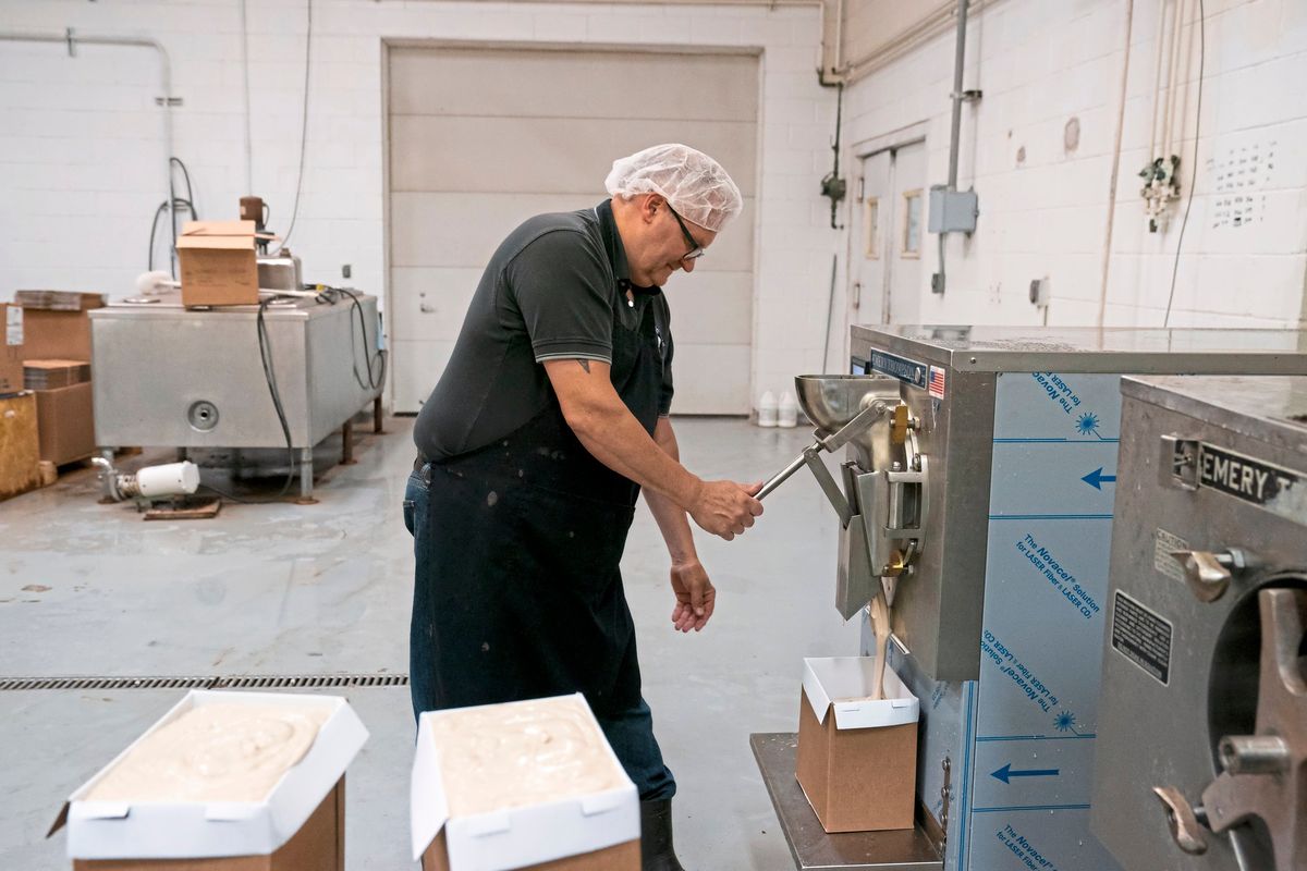 Tom Kerber Jr. Fills up cartons with coffee ice cream at his families dairy and ice cream store Kerber