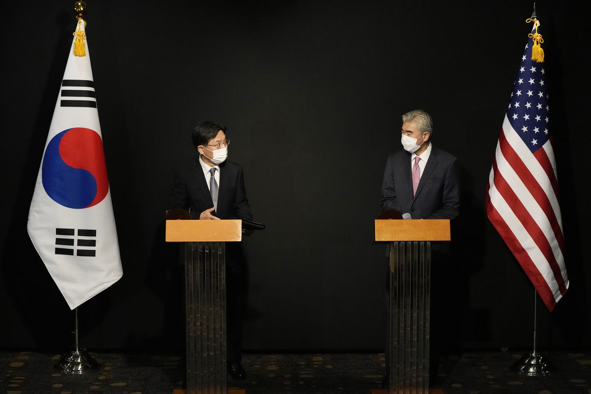 U.S. Special Representative for North Korea, Sung Kim, right, and South Korea's Special Representative for Korean Peninsula Peace and Security Affairs Noh Kyu-duk attend a briefing after their meeting at a hotel in Seoul, South Korea, Sunday, Oct. 24, 2021. (Ahn Young-joon)