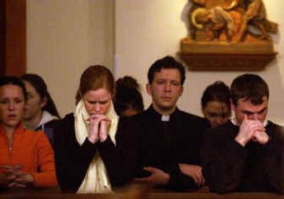 
Gonzaga students pray during a vigil service in the GU Student Chapel on Monday night to remember Pete Tripp and Brian Brett.
 (Liz Kishimoto / The Spokesman-Review)