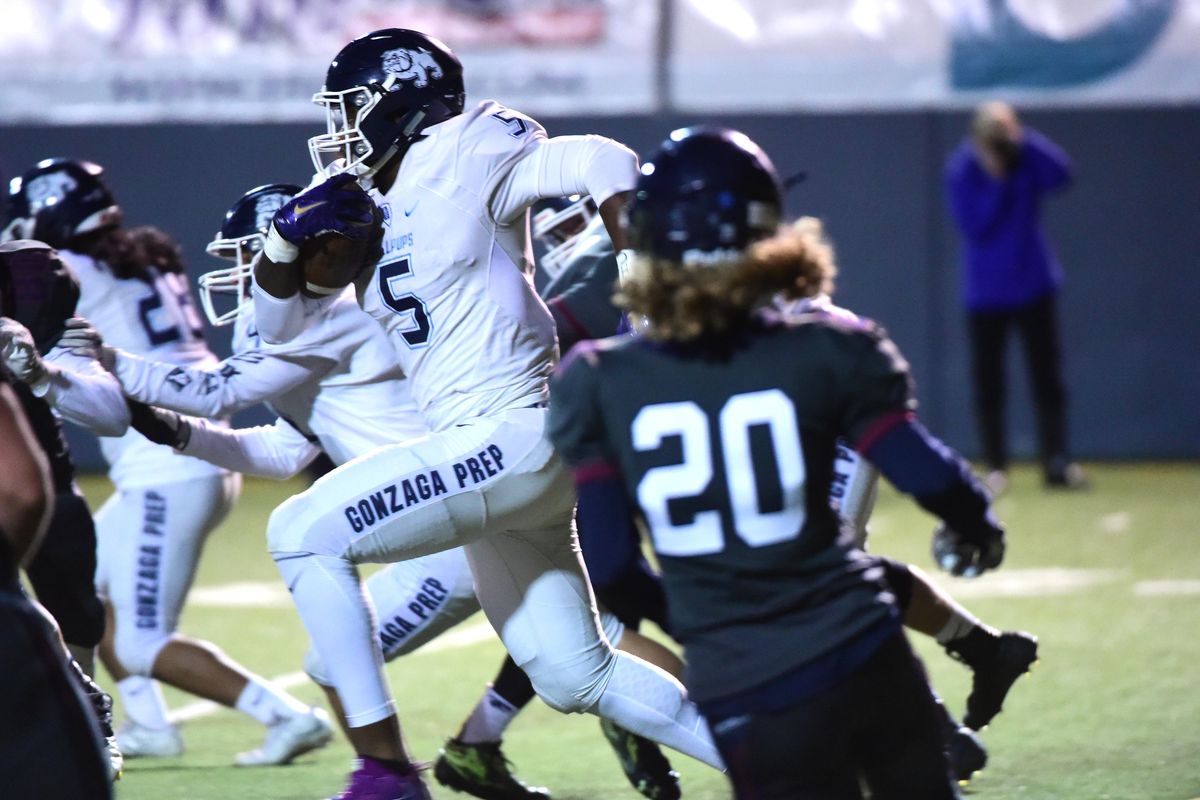 Devin Culp, at 6’5” and 250 pounds, carries a kickoff 95 yards back for a touchdown Friday, Sept. 2017 for the Gonzaga Prep Bullpups at Albi Stadium against the Mt. Spokane Wildcats. (Jesse Tinsley / The Spokesman-Review)