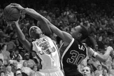 
North Carolina's Rashanda McCants tries to shoot as Duke's Carrem Gay defends during the first half Thursday night.
 (Associated Press / The Spokesman-Review)