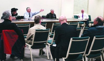 
Liberty Lake Sewer and Water Commissioner Tom Agnew, gesturing. introduces retiring commissioner Harley Halverson, center right, at a meeting Wednesday.
 (J. BART RAYNIAK photos / The Spokesman-Review)