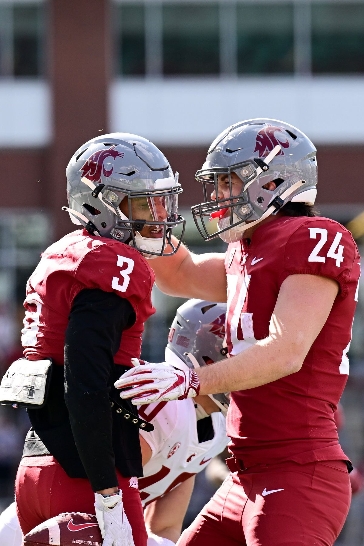 Washington State wide receiver Josh Kelly (3) celebrates with tight end Cooper Mathers during Saturday’s spring game.  (Tyler Tjomsland/The Spokesman-Review)