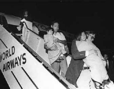 
This photo, taken in Oakland, Calif., in 1975, shows Vietnamese children being taken off a World Airways 