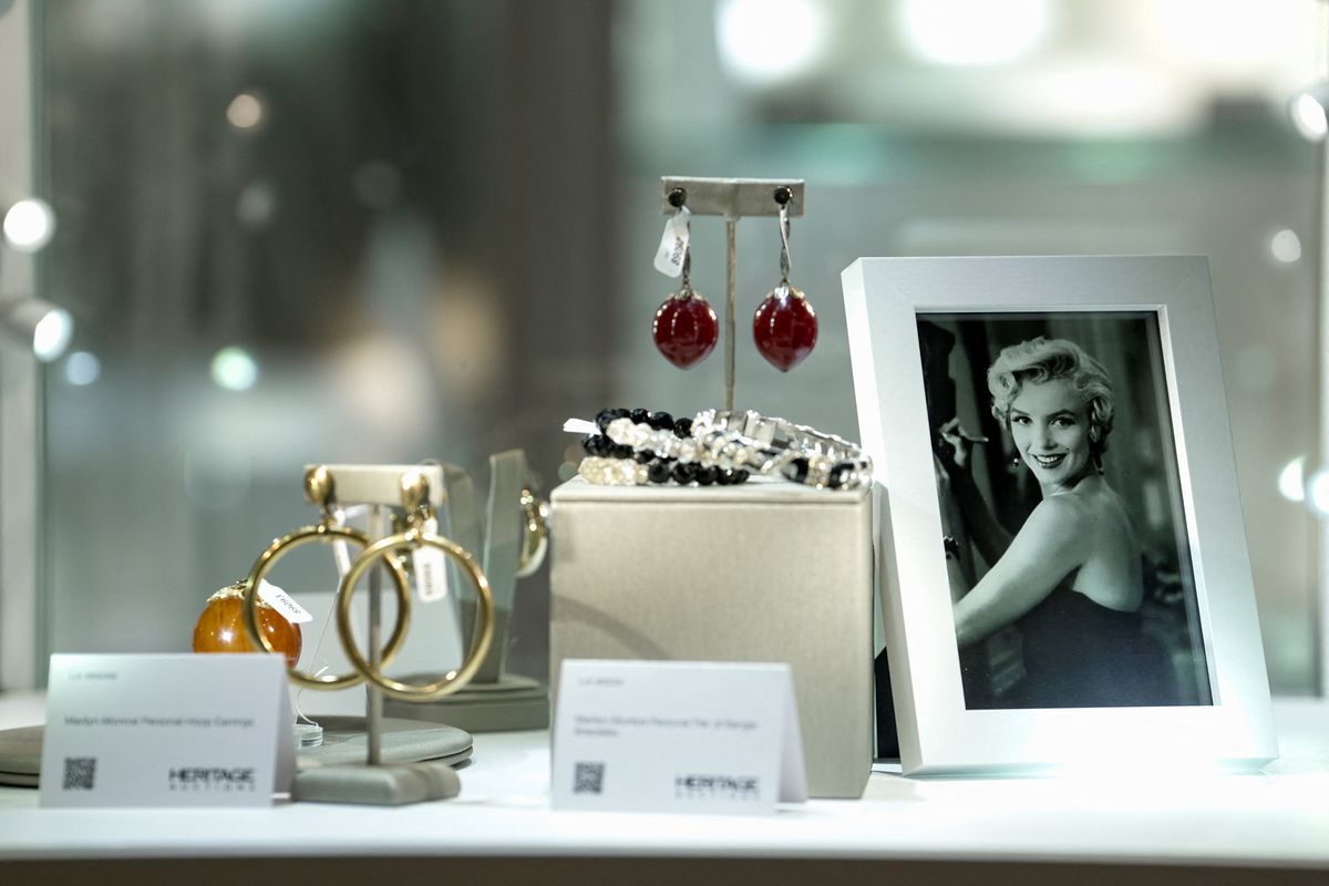 Memorabilia belonging to late model and movie star Marilyn Monroe is displayed alongside a photograph during a preview ahead of an upcoming auction in Los Angeles, California, U.S., May 8, 2026.  (Reuters)