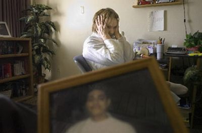 
Glenna Joseph  talks Tuesday in her Spokane apartment  about the  1995 death of her son Ronnie Armstead, seen in the photo in the foreground.
 (Christopher Anderson/ / The Spokesman-Review)