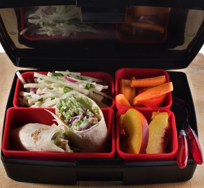 To cut down on wasted bags and wrappers, try the fun BPA-free Laptop Lunch Box, a bento box-like case with several interchangeable containers that hold hot, cold, dry and wet food like this broccoli slaw wrap. McClatchy Tribune (McClatchy Tribune / The Spokesman-Review)