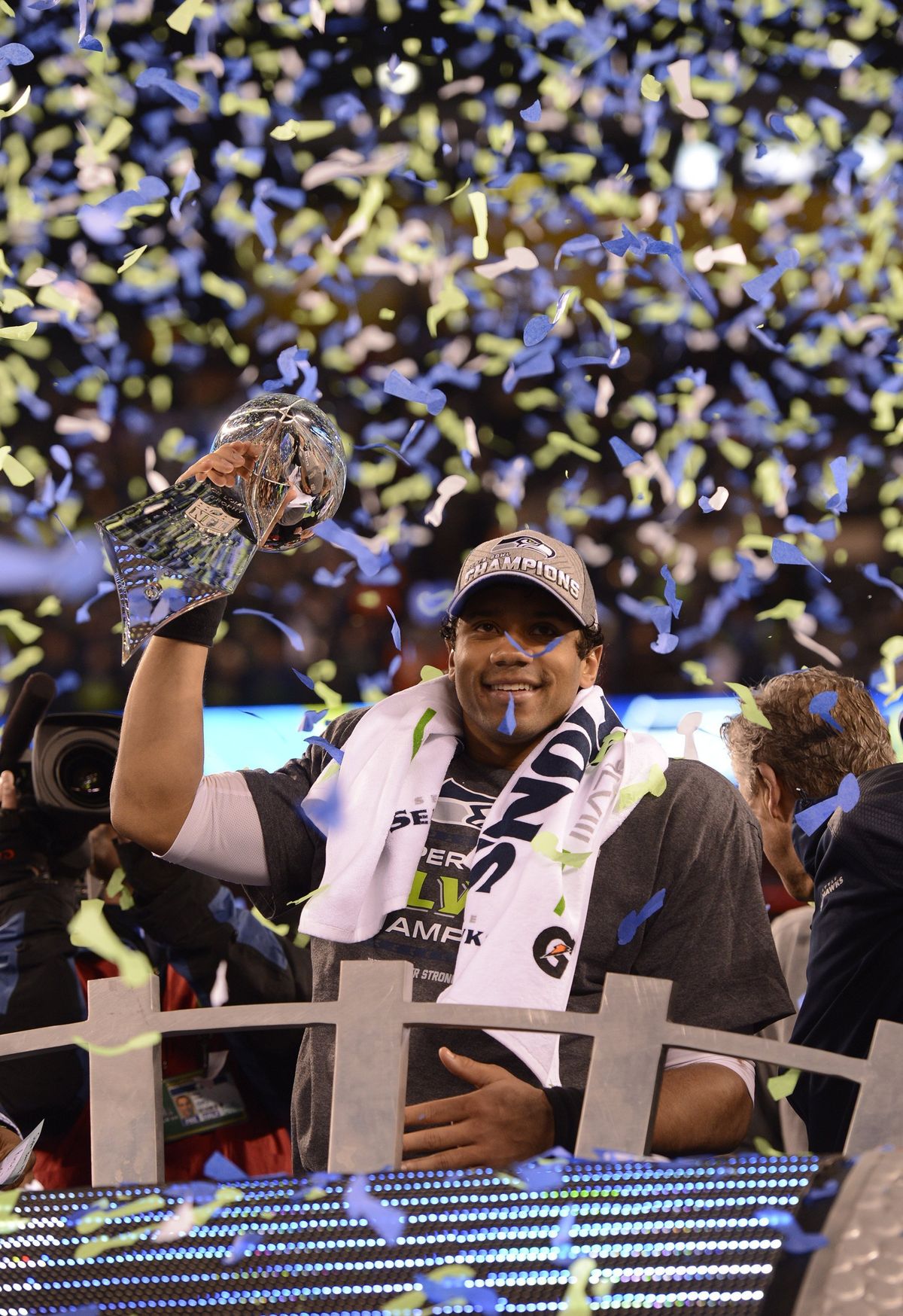 Seahawks quarterback Russell Wilson hoists the Lombardi Trophy after capturing the team’s first and only Super Bowl in early 2014. Does leading that team give Wilson the title as the best player in franchise history? (Tribune News Service)
