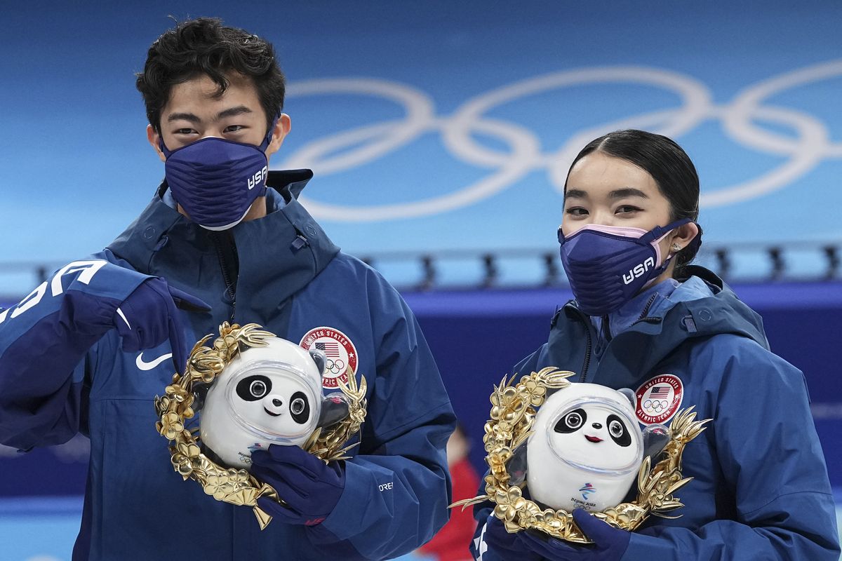 Silver medalists Karen Chen and Nathan Chen pose for a photo after the team event in the figure skating competition at the 2022 Winter Olympics, Monday, Feb. 7, 2022, in Beijing.  (David J. Phillip)