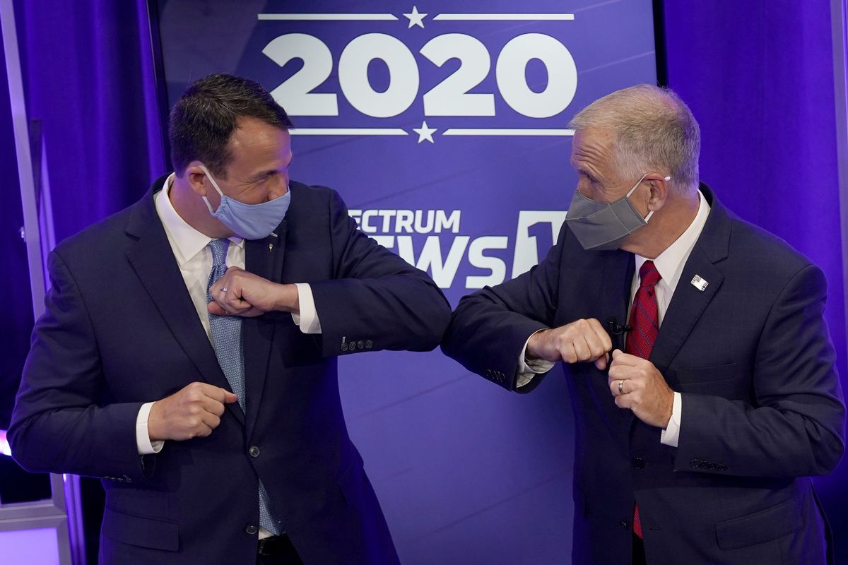 FILE - Democratic challenger Cal Cunningham, left, and U.S. Sen. Thom Tillis, R-N.C. greet each other after a televised debate Thursday, Oct. 1, 2020, in Raleigh, N.C.  (Gerry Broome)