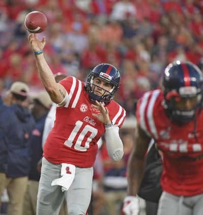 Mississippi quarterback Chad Kelly (10) releases a pass while warming up before an NCAA college football game against Auburn in Oxford, Miss., Saturday, Oct. 29, 2016. (Thomas Graning / Associated Press)