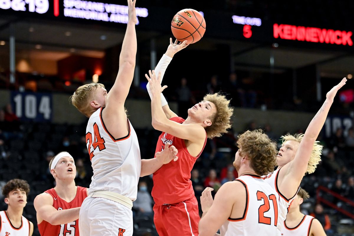 Ferris Trayce Atkins (1) drives to the hoop and scores against Kennewick during the first half of the District 8 3A boys basketball championship game on Friday, Feb 18, 2022, at Spokane Arena in Spokane, Wash. (Tyler Tjomsland/The Spokesman-Review)