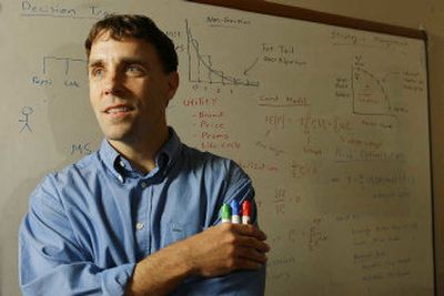 Ken Ouimet, chief scientist for the Industry Business Trade Unit of SAP AG, works on mathematical modeling at SAP offices Wednesday in Scottsdale, Ariz.
(Associated Press / The Spokesman-Review)