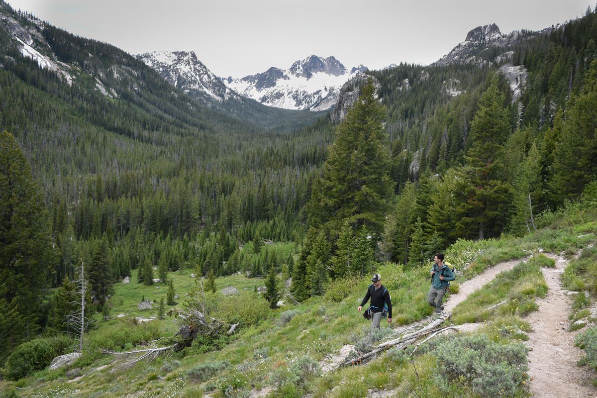ABOVE: Austin Burns, left, and Will Holmquist hike in the Sawtooth Wilderness on June 27, 2019. TOP: The wilderness area is part of the larger Sawtooth National Recreation area and is a recreational paradise for hikers, bikers, climbers, anglers and wildlife watchers. (Eli Francovich / The Spokesman-Review)