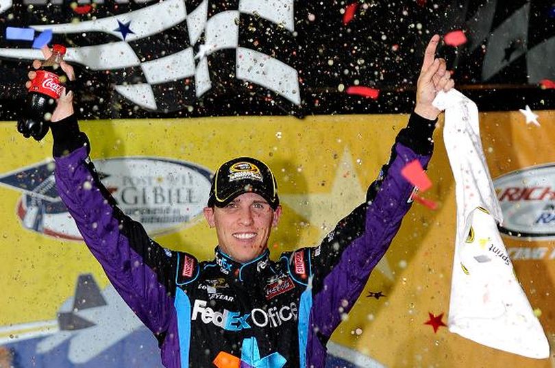 Denny Hamlin celebrates winning the Air Guard 400 at Richmond International Raceway, his second victory at his hometown track. (Photo courtesy of  John Harrelson/Getty Images for NASCAR) (John Harrelson / Getty Images North America)