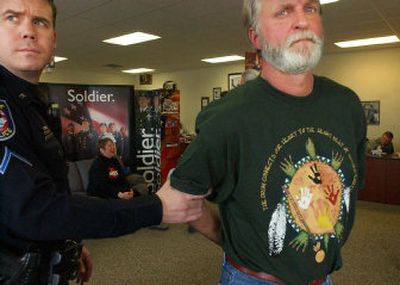 
Mark Hamlin, right, is one of five protesters arrested Monday at the Army National Guard recruiting station on Division Street. 
 (Kathryn Stevens / The Spokesman-Review)
