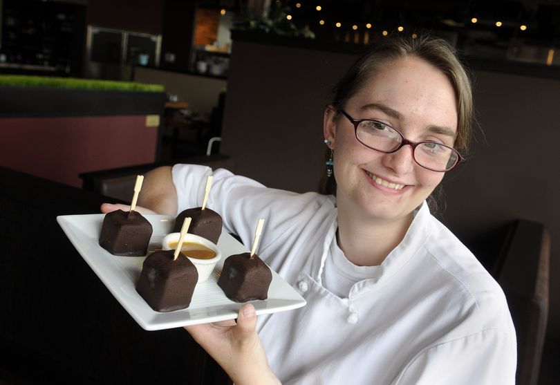 Emily Chapman has created Eskimo Bites, the signature dessert for Savory Restaurant in Spokane, Wash. The frozen treats contain brownies, vanilla ice cream and chocolate ganache. (Dan Pelle / The Spokesman-Review)
