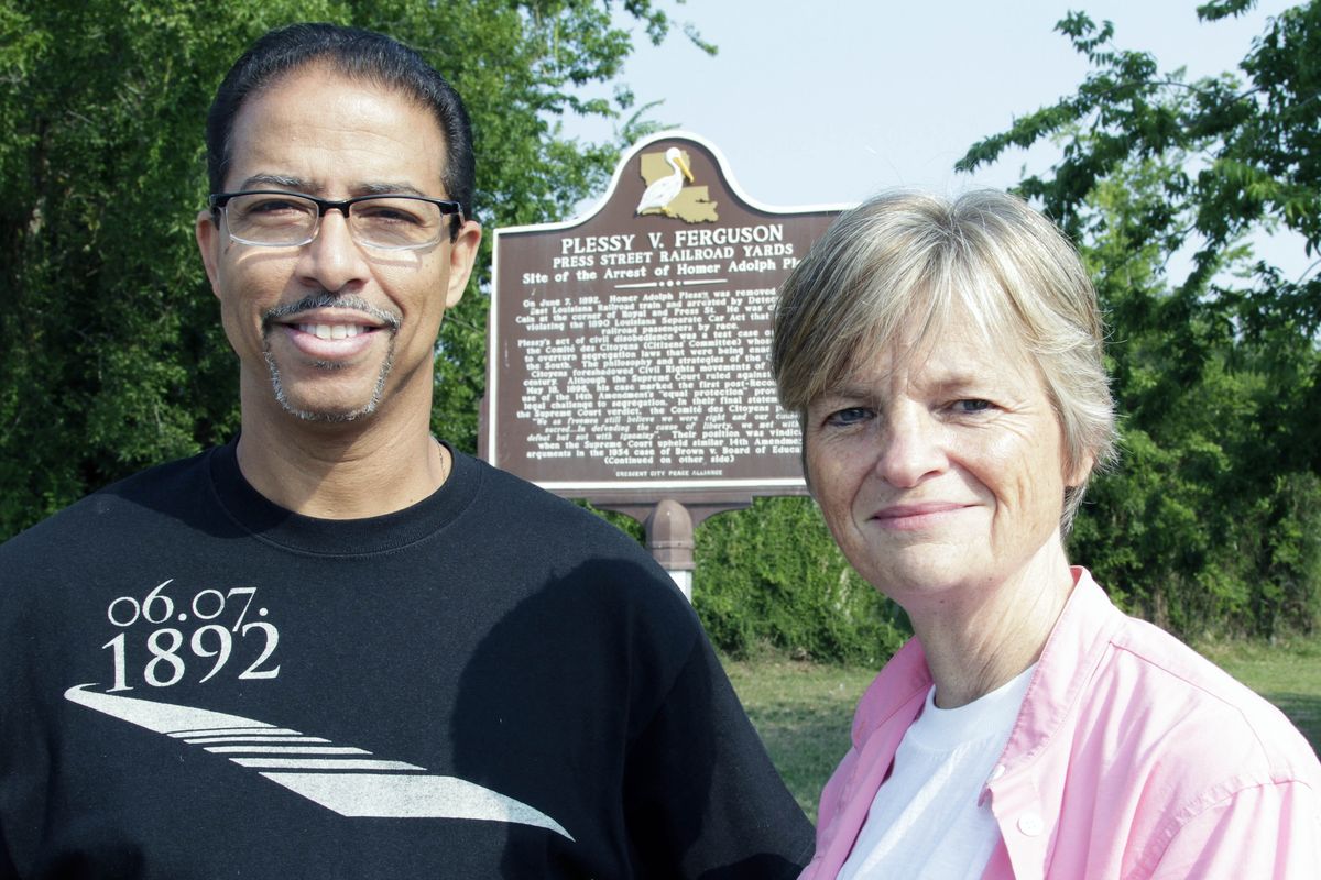 FILE - Keith Plessy and Phoebe Ferguson, descendants of the principals in the Plessy V. Ferguson court case, pose for a photograph in front of a historical marker in New Orleans, on Tuesday, June 7, 2011. Homer Plessy, the namesake of the U.S. Supreme Court