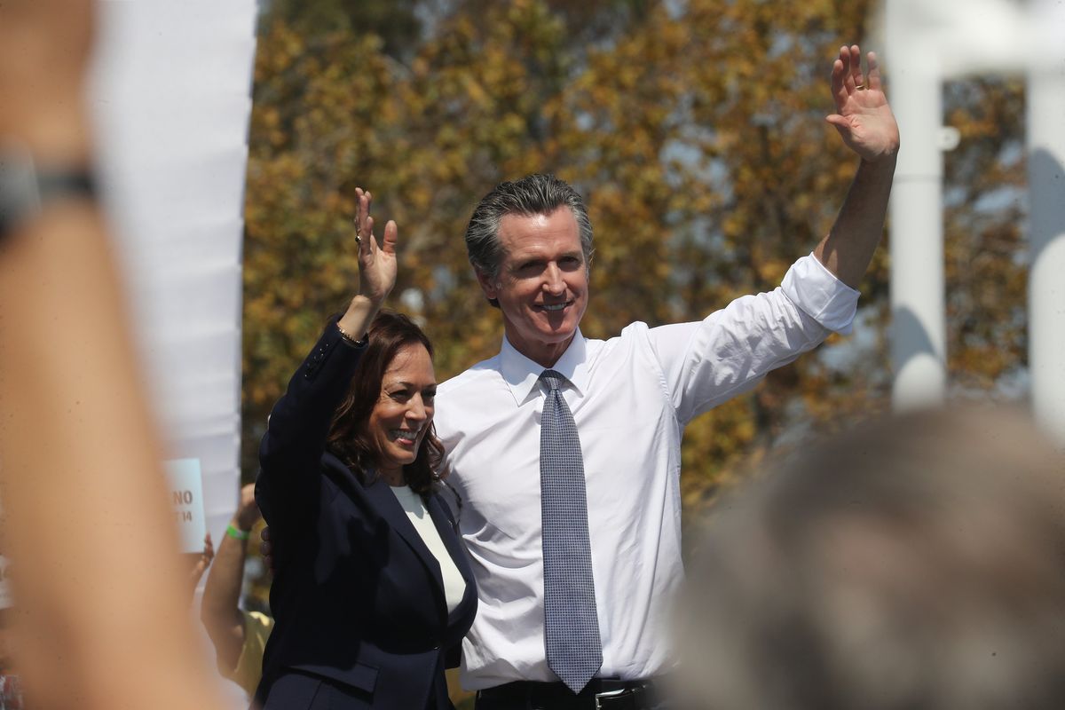 Vice President Kamala Harris, left, joins California Gov. Gavin Newsom at a rally in San Leandro, Calif., on Sept. 8, 2021. The California governor has become the most visible Democrat-in-waiting. His support of the president is a key part of his effort to put himself forward for the next campaign.  (JIM WILSON)