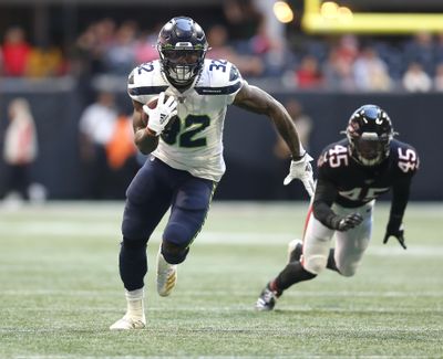 Seattle running back Chris Carson, who is eighth in the league in rushing yards, might lose some carries to Rashaad Penny if Penny can continue to play like he did in the Seahawks’ win over the Eagles. (Michael Zarrilli / AP)