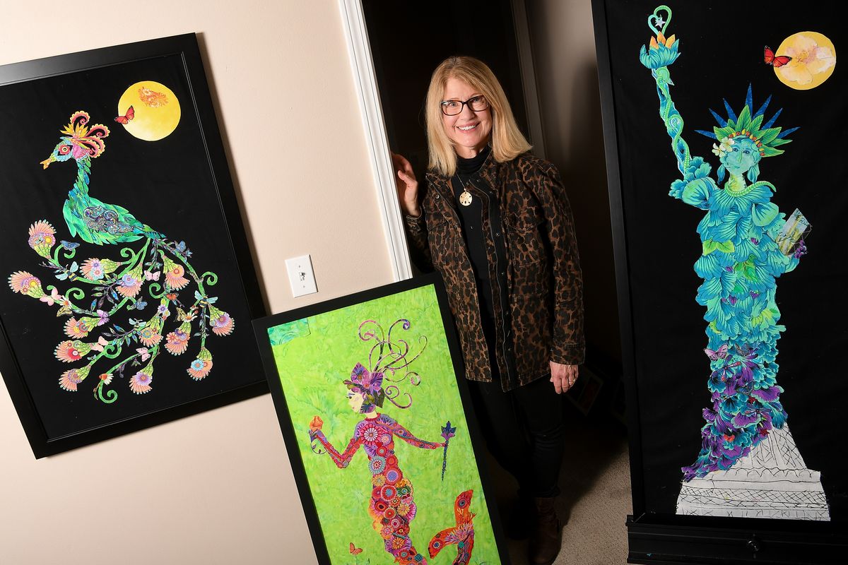 Carole Imus is photographed with some of her fabric art pictures on Thursday, Jan. 7, 2021, at her home in Spokane Valley. She has finished a peacock, mermaid and a seahorse and is completing Lady Liberty. (Tyler Tjomsland/THE SPOKESMAN-REVIEW)