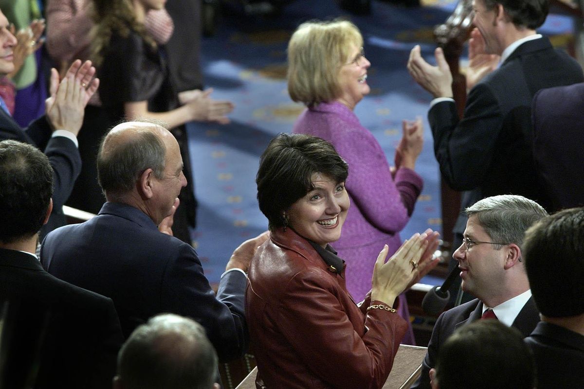 FILE - Fifth Congressional District Represenitive Cathy McMorris flashes a giant smile toward her parents, brother, grandmother and friends sitting in the gallery in January 2005 on the floor of the United States House of Representives in Washington DC, as the members of Congress were sworn in. (Dan Pelle / The Spokesman-Review)