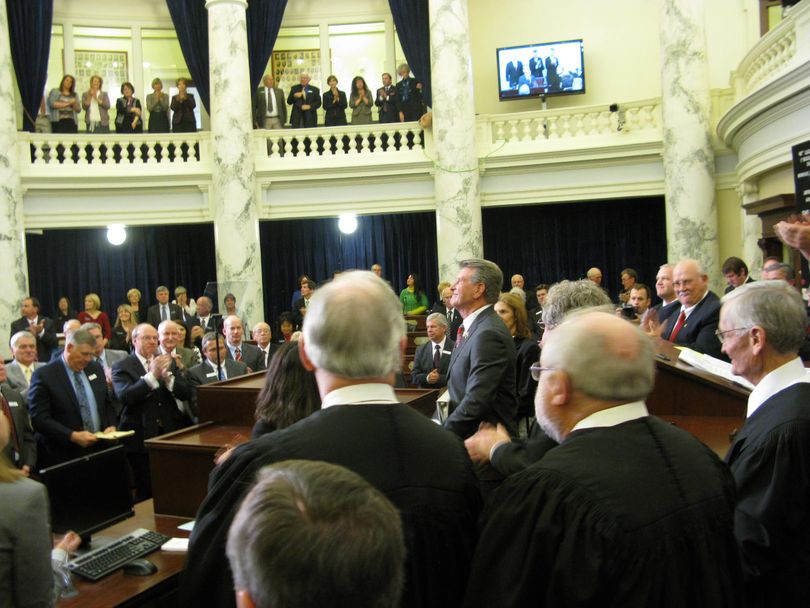 Gov. Butch Otter is applauded by lawmakers at the end of his State of the State message on Monday (Betsy Russell)