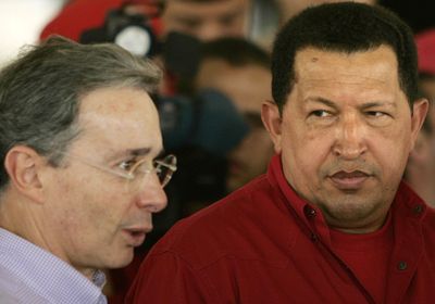 Venezuelan President Hugo Chavez, right, listens to Colombian President Alvaro Uribe on Friday.  (Associated Press / The Spokesman-Review)