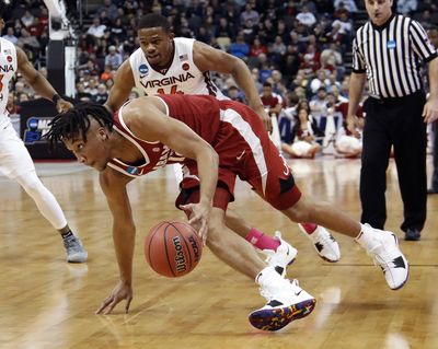 Alabama’s Dazon Ingram goes low on a drive to the basket in the first half on Thursday in Pittsburgh. (Gene J. Puskar / AP)