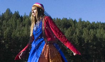 
Meghan Nuttall Sayres walks through her expansive yard dressed in clothes sewn by Naheed Dareshuri, a former nomad from Iran now living in the Philadelphia area.
 (Christopher Anderson / The Spokesman-Review)