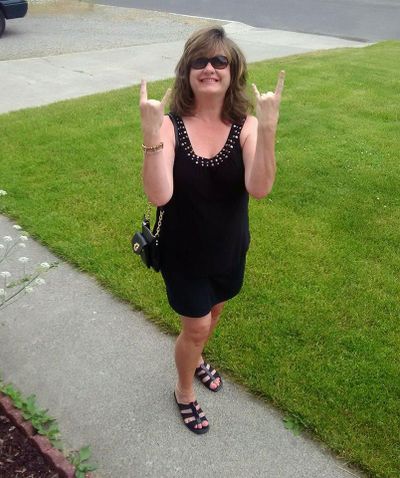 Cindy Hval flashes the symbol for rock ’n’ roll on her way to review the Def Leppard concert for The Spokesman-Review. (Courtesy of Cindy Hval)