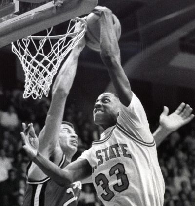 In this March 4, 1988, photo, North Carolina State NCAA college basketball player Charles Shackleford (33) battles against a Maryland player in Raleigh, N.C. Shackleford, a North Carolina State basketball star in the 1980s who spent six seasons in the NBA, was found dead in his home Friday, Jan. 27, 2017, in Kinston, N.C. He was 50. (News & Observer via AP)