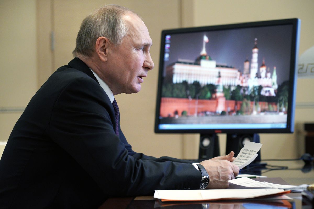 Russian President Vladimir Putin speaks during a meeting via video conference with officials and government cabinet members in Moscow, Russia, Thursday, March 11, 2021.  (Alexei Druzhinin)