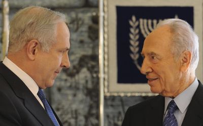 Likud Party leader Benjamin Netanyahu, left, talks with Israel’s President Shimon Peres after their press conference at the president’s residence in Jerusalem on Friday.  (Associated Press / The Spokesman-Review)