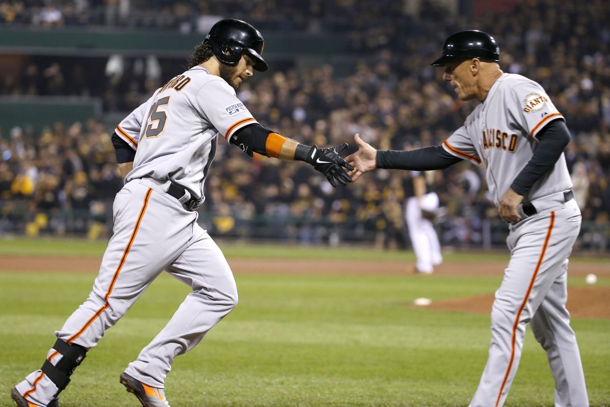 Brandon Crawford, left, is congratulated after becoming first shortstop to hit grand slam in postseason. (Associated Press)