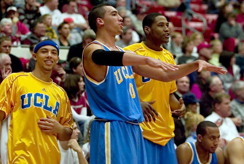 UCLA's Drew Gordon, J'mison Morgan, right, and Blake Arnet, left, celebrate after Nikola Dragovic hit a 3-point shot during the first half. (Dean Hare / Associated Press)