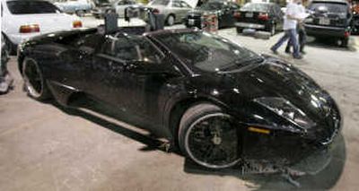 
A damaged black Lamborghini registered to Chicago Bears football player Lance Briggs was found abandoned. Associated Press
 (Associated Press / The Spokesman-Review)