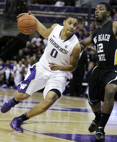 Washington lost point guard Abdul Gaddy, left, to a torn ACL in practice in January. (Associated Press)