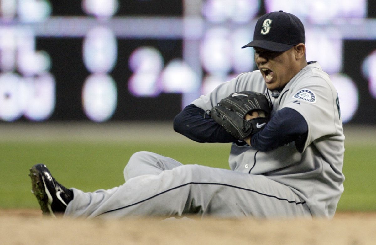 Felix Hernandez of the Mariners was a little banged up in the third inning, but stayed in the game through seven innings.   (Associated Press / The Spokesman-Review)