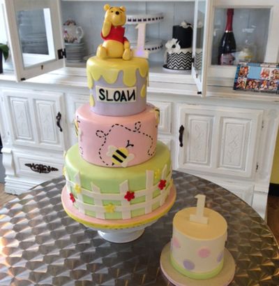 This photo provided by Tiffany Jones was posted to the Instagram account of her company, Peridot Sweets in Las Vegas. It shows a Winnie the Pooh cake with coordinating smash cake. Jones says this cake had the most Instagram “likes” of all her children’s cakes. (Associated Press)