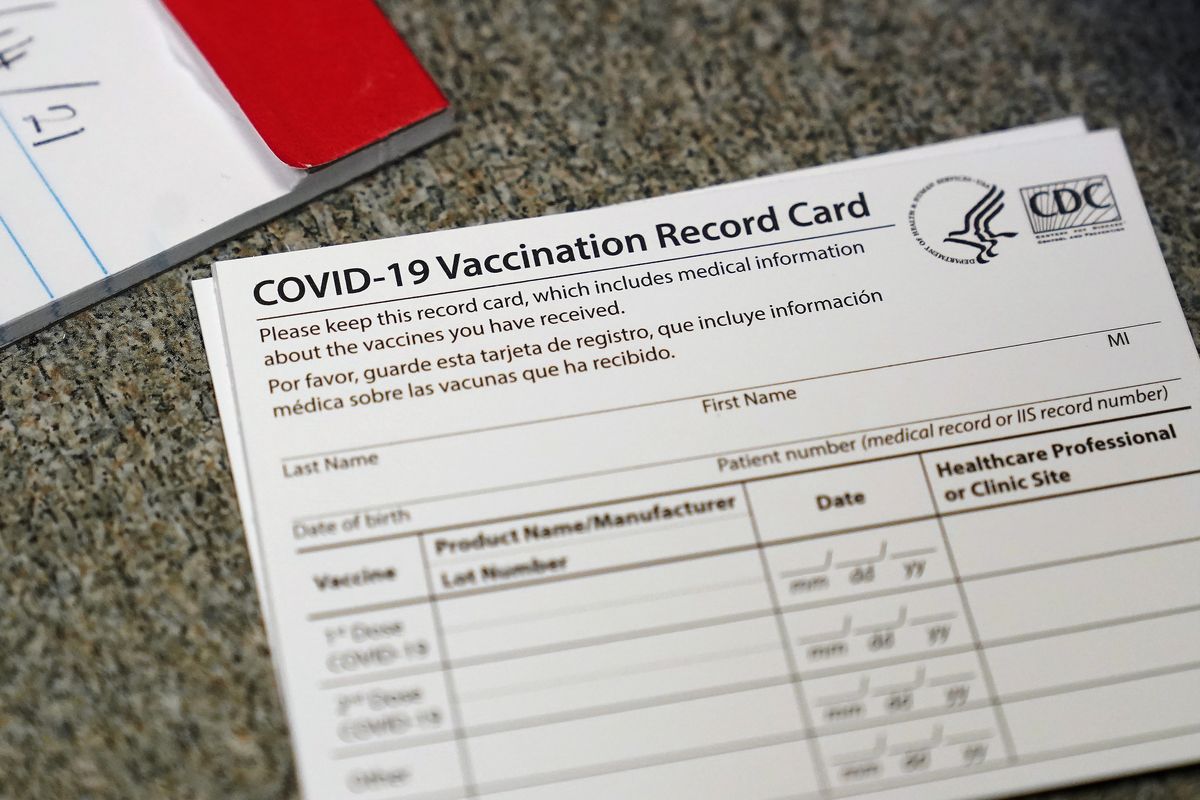FILE - In this Dec. 24, 2020, file photo, a COVID-19 vaccination record card is shown at Seton Medical Center in Daly City, Calif. Los Angeles leaders are poised to enact one of the nation