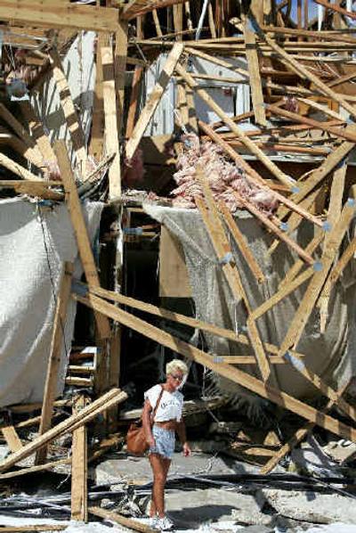 
Susan Shaw views her home, which was destroyed by Hurricane Ivan, in Perdido Key, Fla., Monday. Residents of Perdido Key were allowed to return to their homes via shuttle for the first time since Hurricane Ivan struck the area. 
 (Associated Press / The Spokesman-Review)