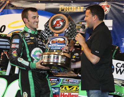 Austin Dillon celebrates win with track owner Tony Stewart in NASCAR’s return to dirt racing. (Associated Press)