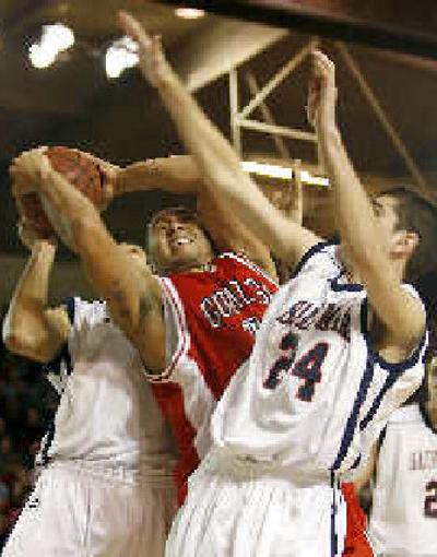 
J.P. Batista is fouled by a Saint Mary's defender as Todd Golden, right, looks on. 
 (Associated Press / The Spokesman-Review)