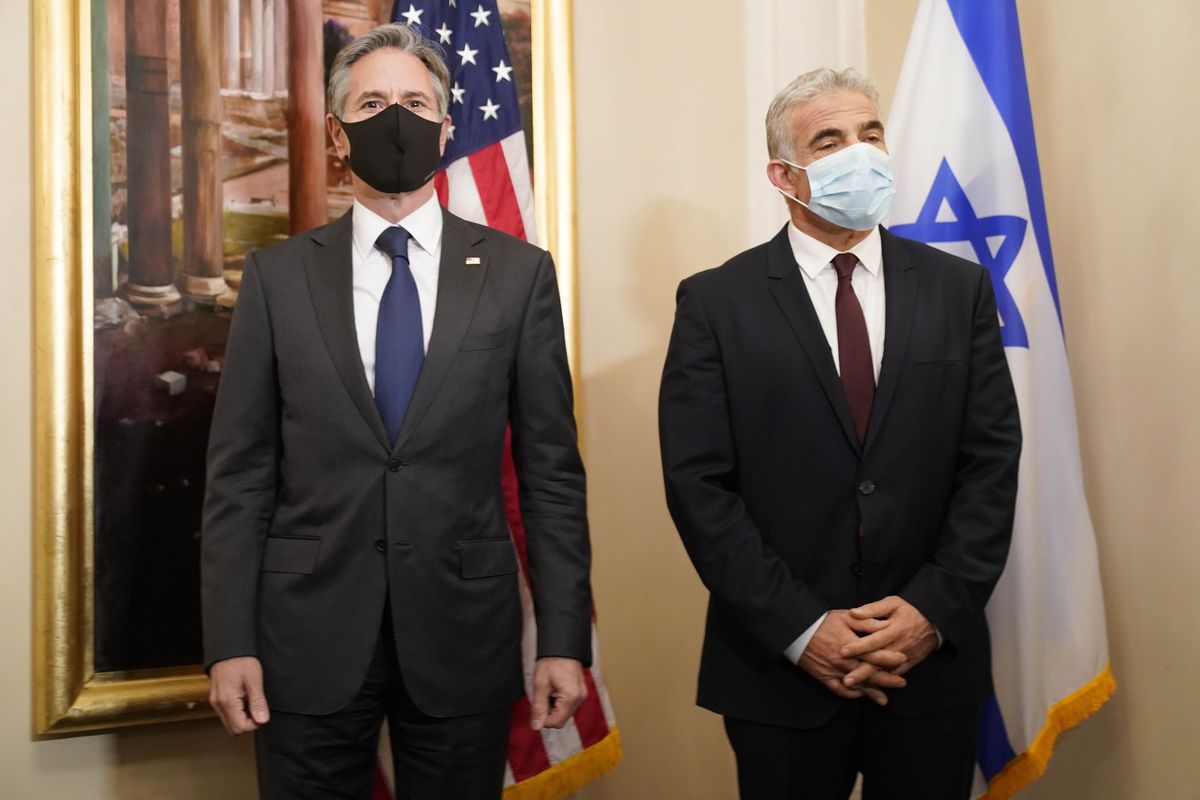 Secretary of State Antony Blinken, left, and Israeli Foreign Minister Yair Lapid pose for a family picture during their meeting in Rome, Sunday, June 27, 2021. Blinken is on a week long trip in Europe traveling to Germany, France and Italy. (Andrew Harnik)