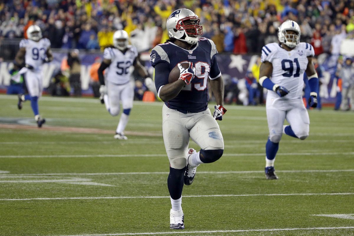 New England running back LeGarrette Blount is off and running for a 73-yard touchdown, one of his four rushing TDs on the day. (Associated Press)
