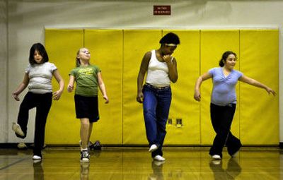 
From left, Olivia Thornblade, 10, Jordyn Utter, 11, Onjole Jackson, 10, and Asia Salazar, 10, practice their moves at Regal Elementary School.
 (The Spokesman-Review)