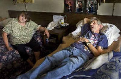 
After a robber stole a purse containing all their money and medications last week, Bonnie Smith sits in a motel room with her husband, Wayne, who is dying of liver cancer. 
 (Colin Mulvany / The Spokesman-Review)