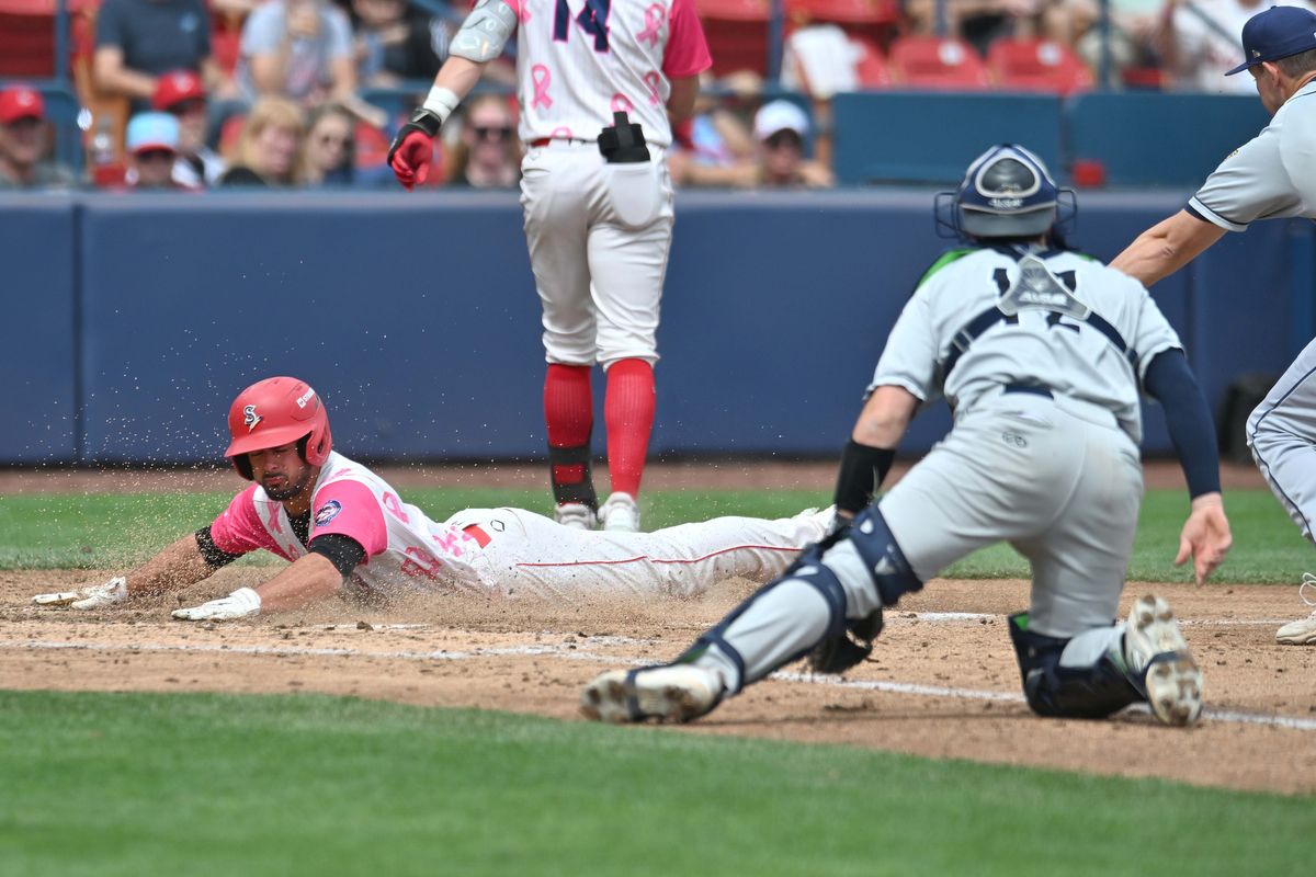 Indians outfielder Jacob Humphrey slides into home safely against the Tri-City Dust Devils on Sunday at Avista Stadium.  (James Snook)