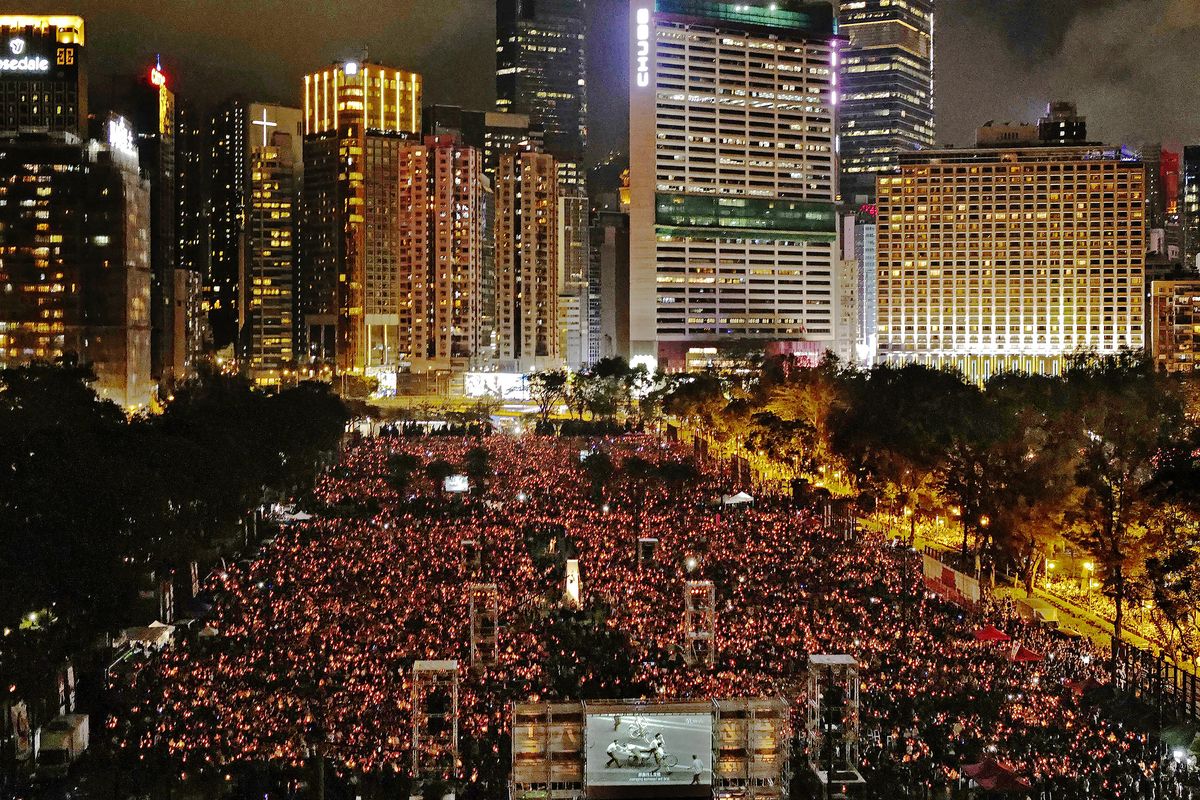 FILE-In this Tuesday, June 4, 2019, file photo, thousands of people attend a candlelight vigil for victims of the Chinese government